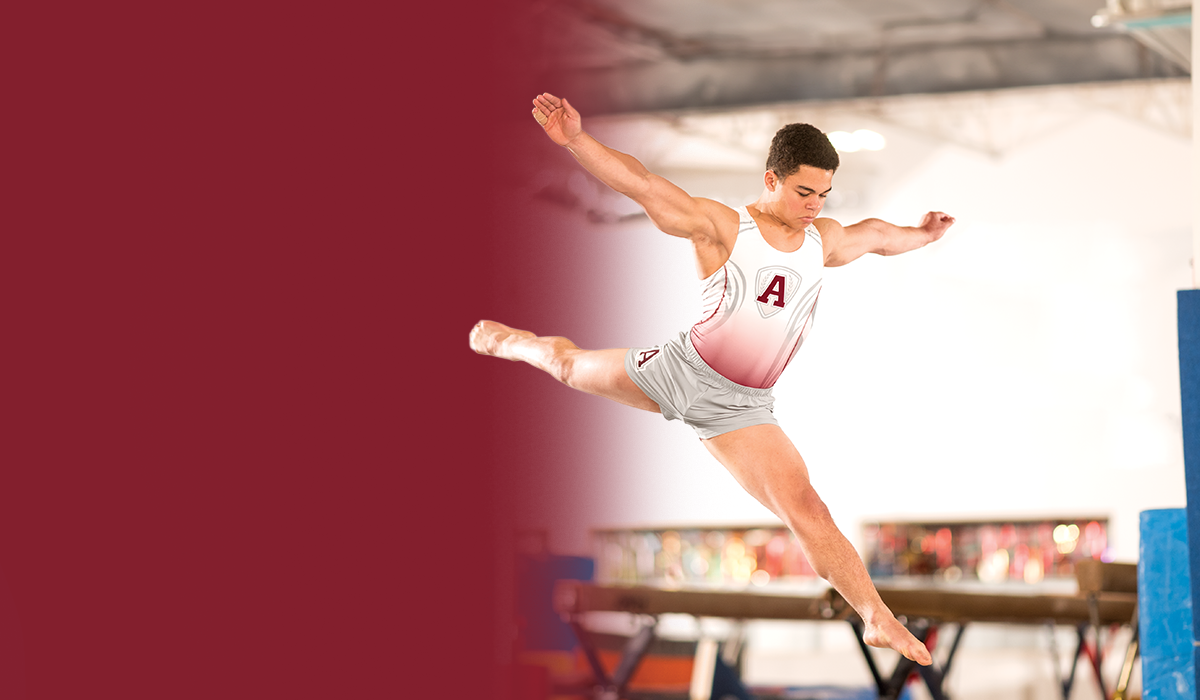 Male Gymnast in motion wearing Champion competition singlets and bottoms