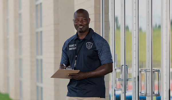 Coach wearing Champion Lacrosse Coaches Gear