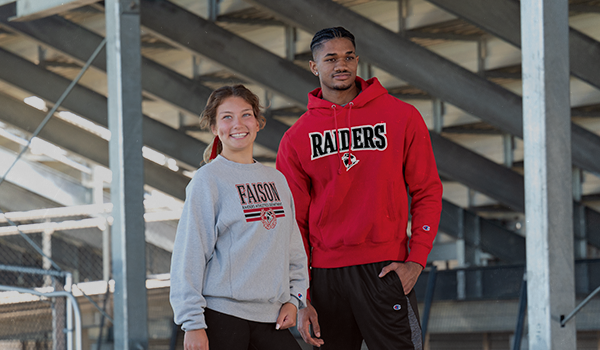 Male and female wearing Champion outerwear