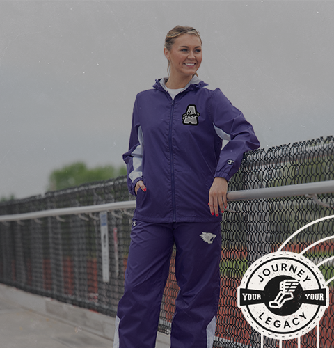 Male Wearing Champion Track Warm-Ups and carrying duffle bag