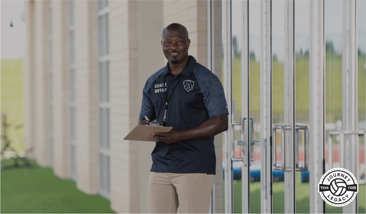 Male Holding Clipboard Wearing Champion Volleyball Coach's Gear