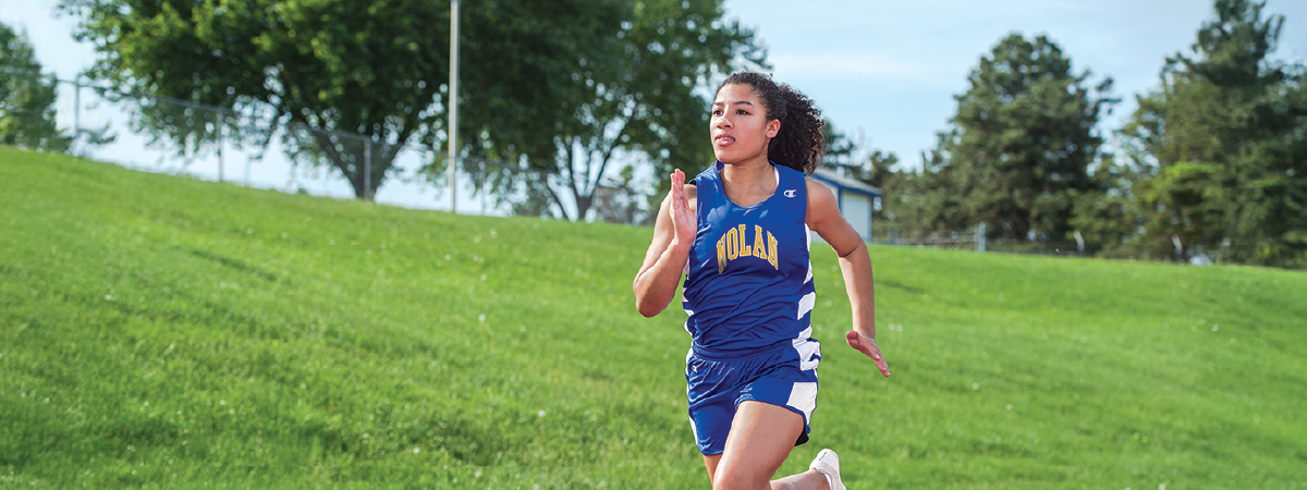 Two Cross Country runners wearing Champion tops